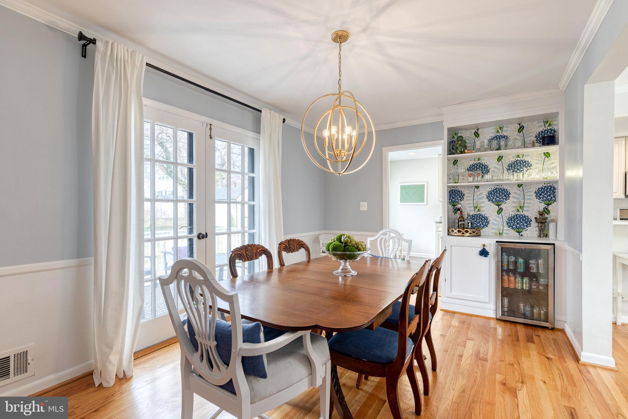8206 Burnley Road Towson, MD 21204 - Photo 3 of 37 a view of a dining room with furniture window and wooden floor