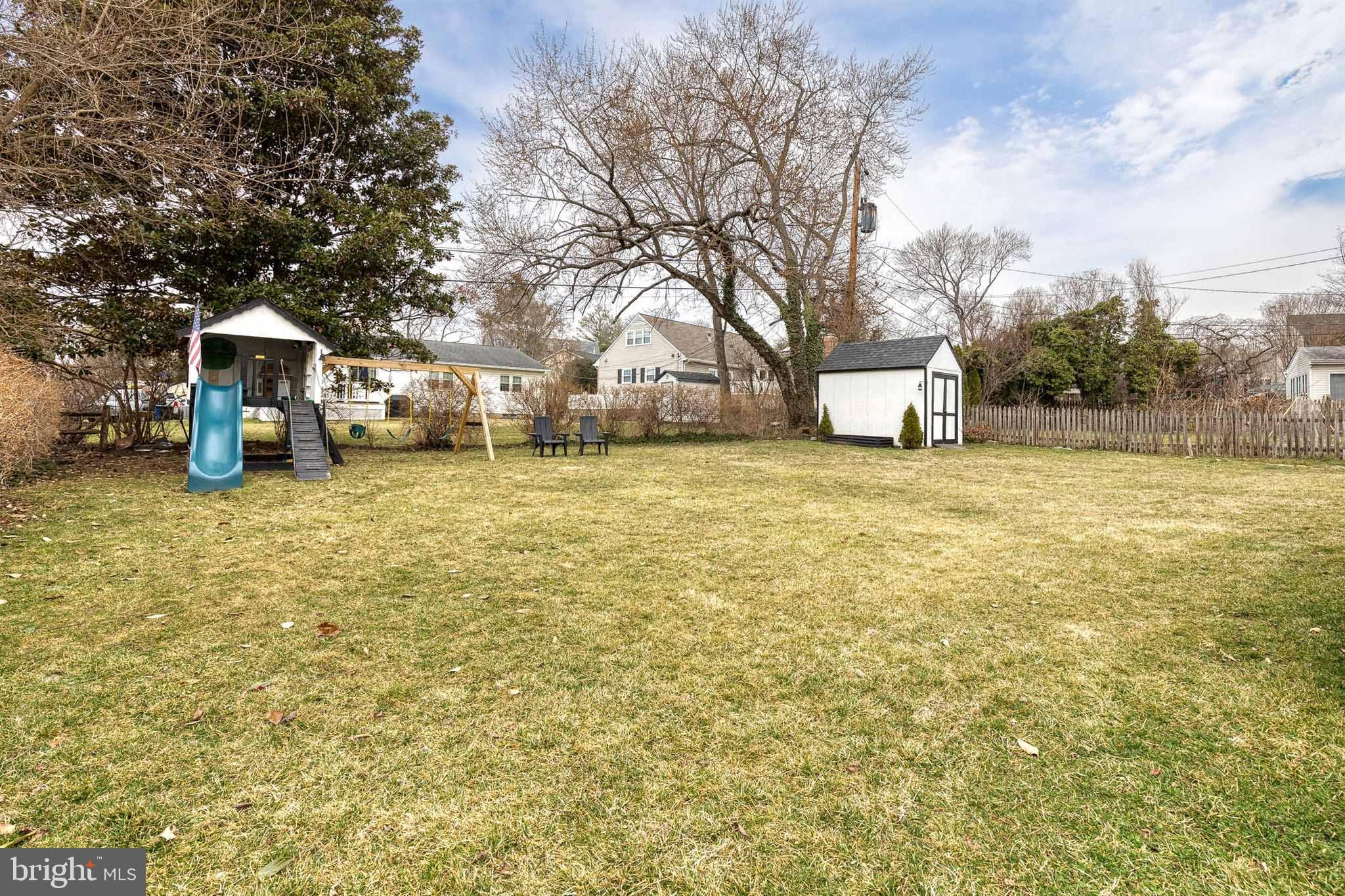 8206 Burnley Road Towson, MD 21204 - Photo 34 of 37 a view of a yard with a house and large trees