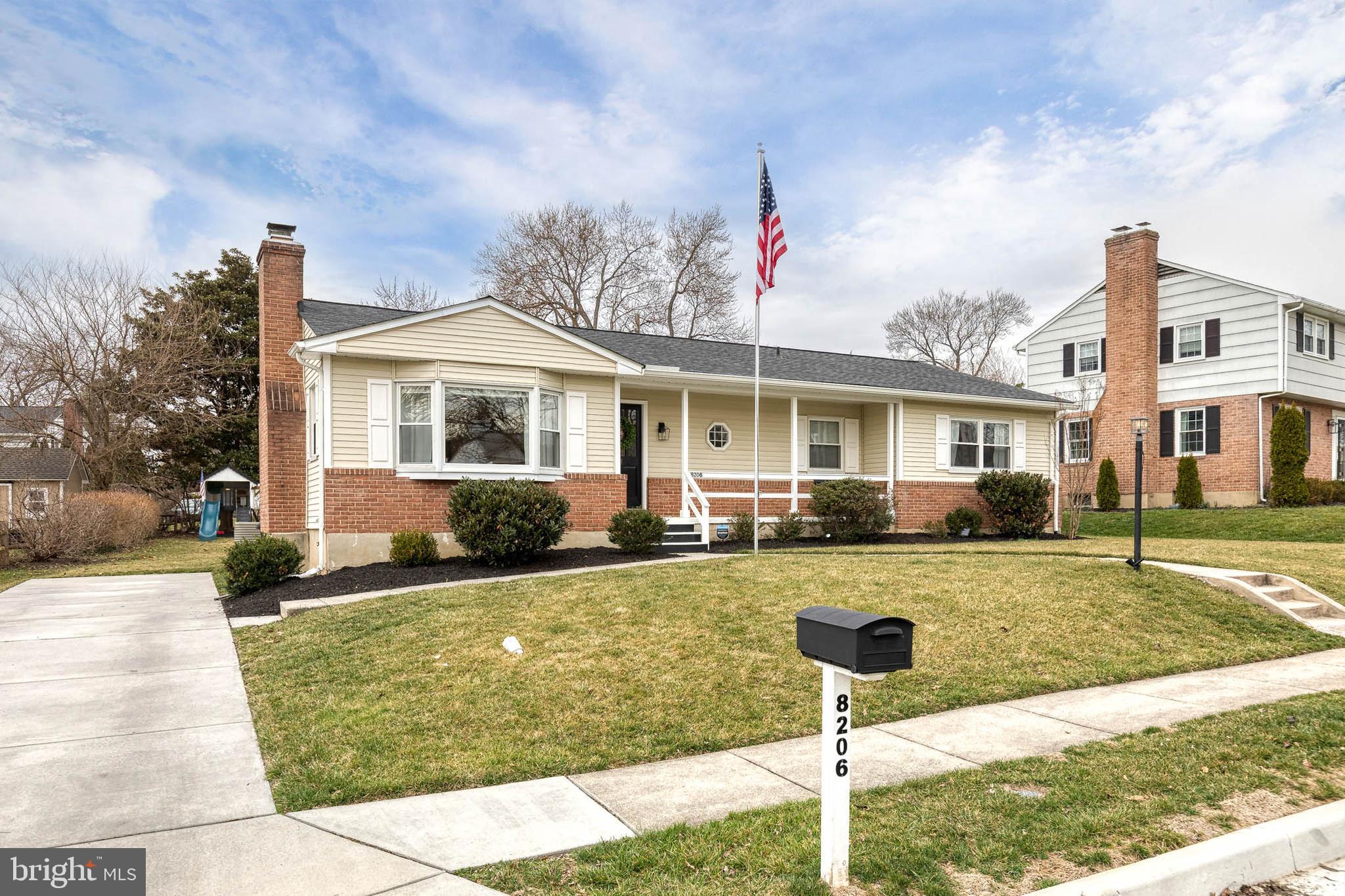 8206 Burnley Road Towson, MD 21204 - Photo 5 of 37 a front view of a house with garden