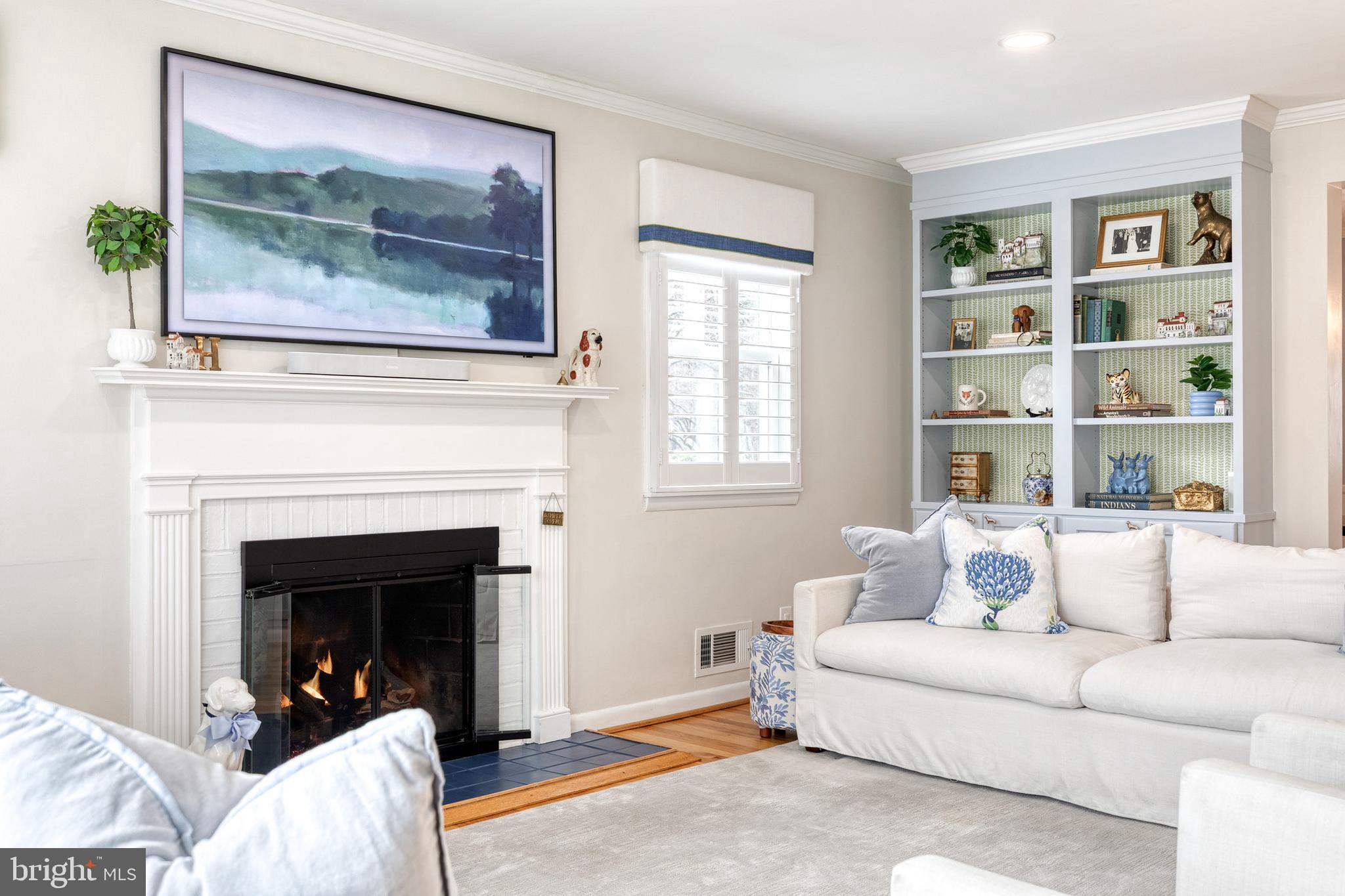 8206 Burnley Road Towson, MD 21204 - Photo 8 of 37 a living room with furniture and a fireplace