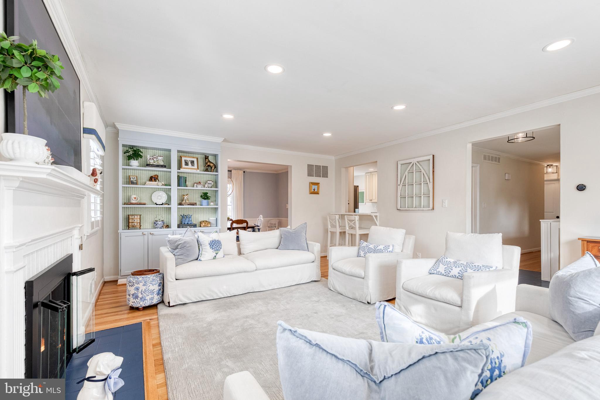 8206 Burnley Road Towson, MD 21204 - Photo 9 of 37 a living room with fireplace furniture and a large window