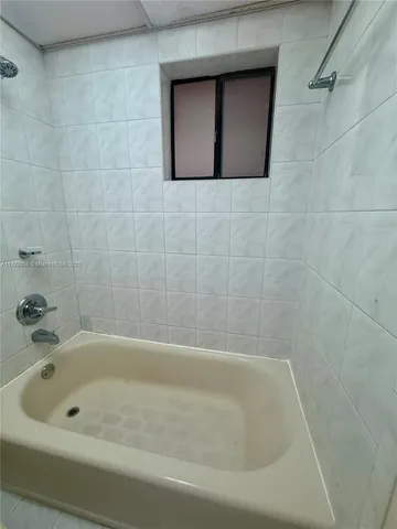 a bathroom with a sink toilet and mirror
