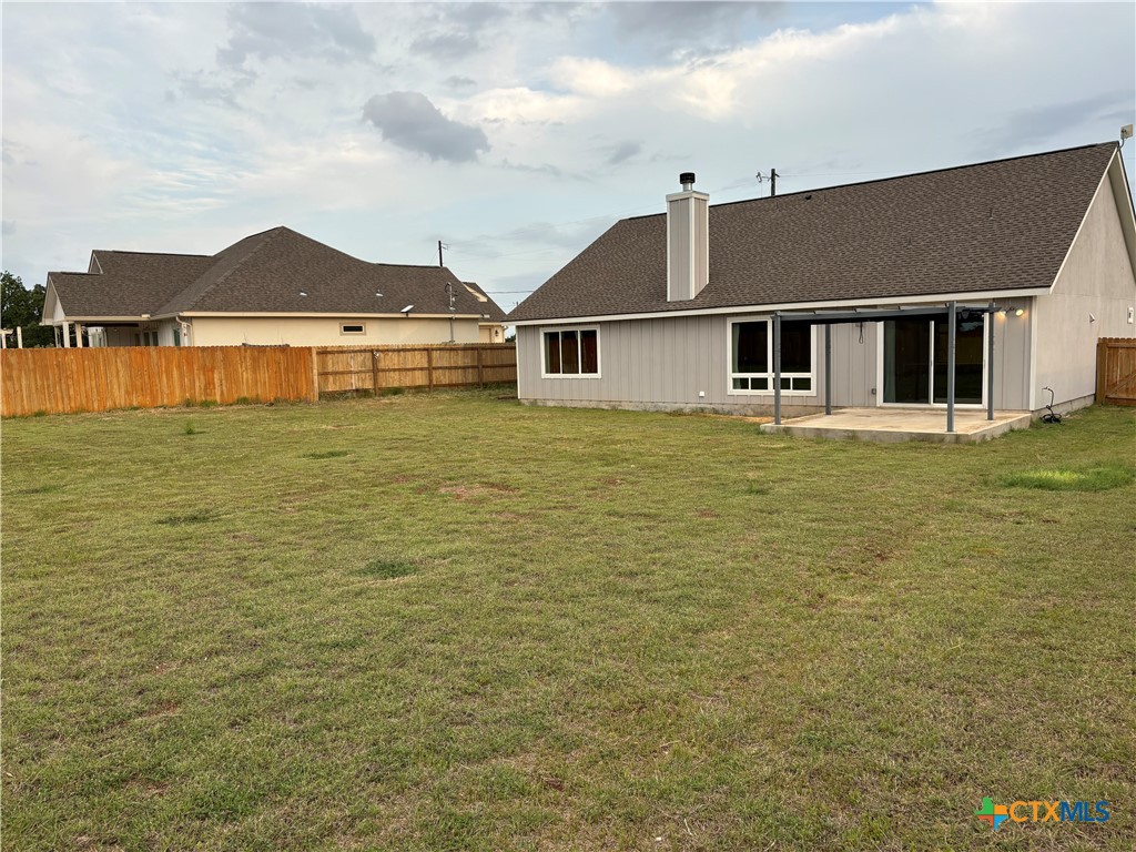 110 Hiram Cook Blanco, TX 78606 - Photo 4 of 46 a front view of a house with a yard
