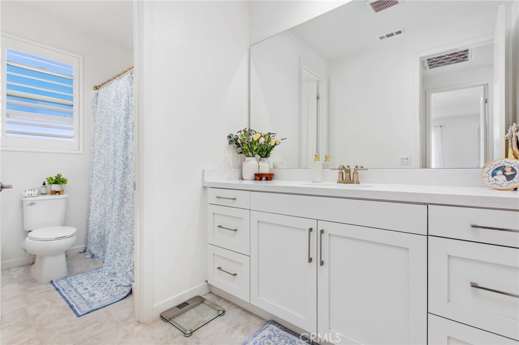 32797 Hayden Road Menifee, CA 92584 - Photo 26 of 51 a bathroom with a sink a toilet and a mirror
