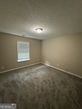 an empty room with a empty space and window