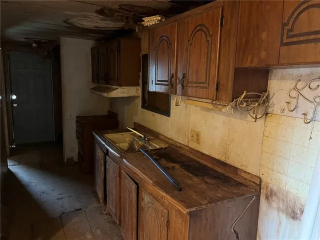 a kitchen with a stove and a refrigerator
