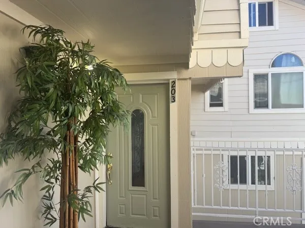 a view of a house with a tree
