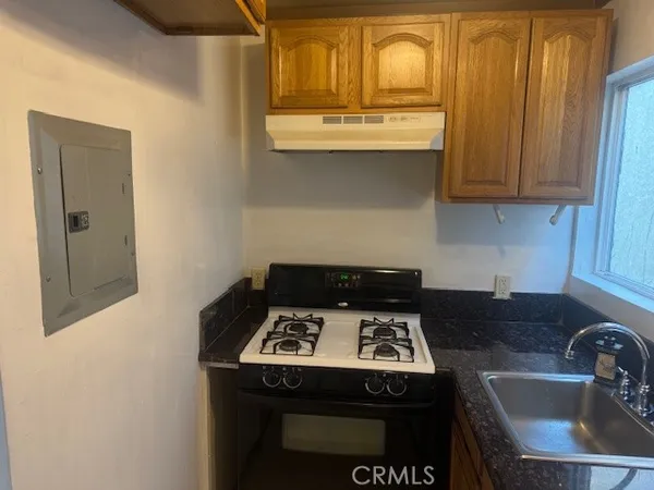 a kitchen with a stove and a sink
