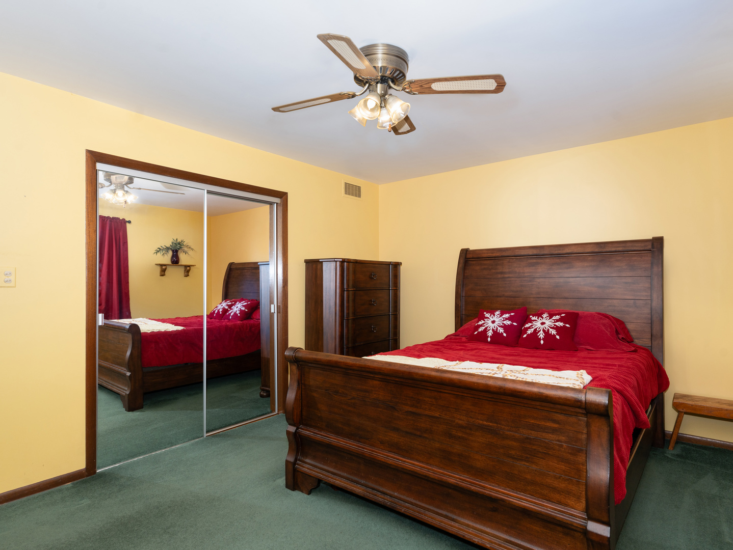 10S144 Ridge Road Naperville, IL 60565 - Photo 11 of 28 a bedroom with a bed and a chandelier