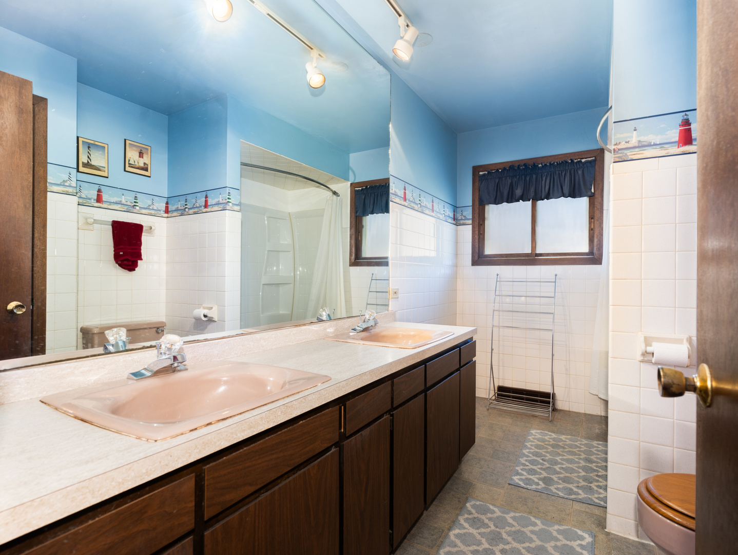 10S144 Ridge Road Naperville, IL 60565 - Photo 14 of 28 a bathroom with a sink and a mirror