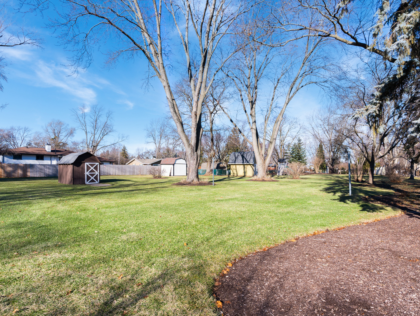 10S144 Ridge Road Naperville, IL 60565 - Photo 24 of 28 a backyard of a house with a table and chairs