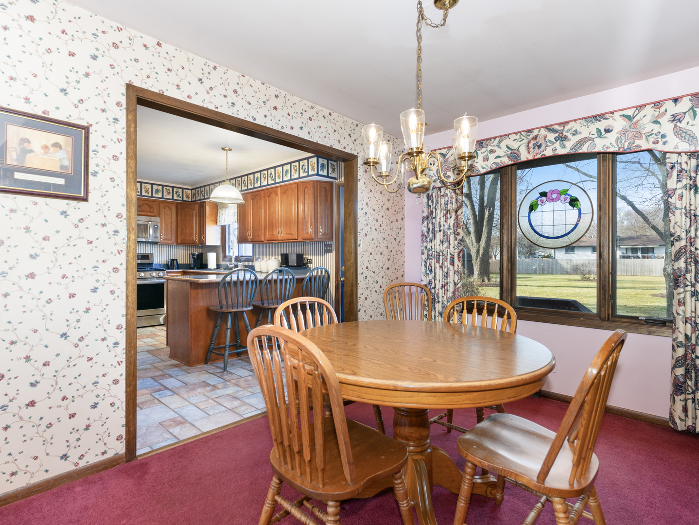 10S144 Ridge Road Naperville, IL 60565 - Photo 6 of 28 a dining room filled with furniture and chandelier
