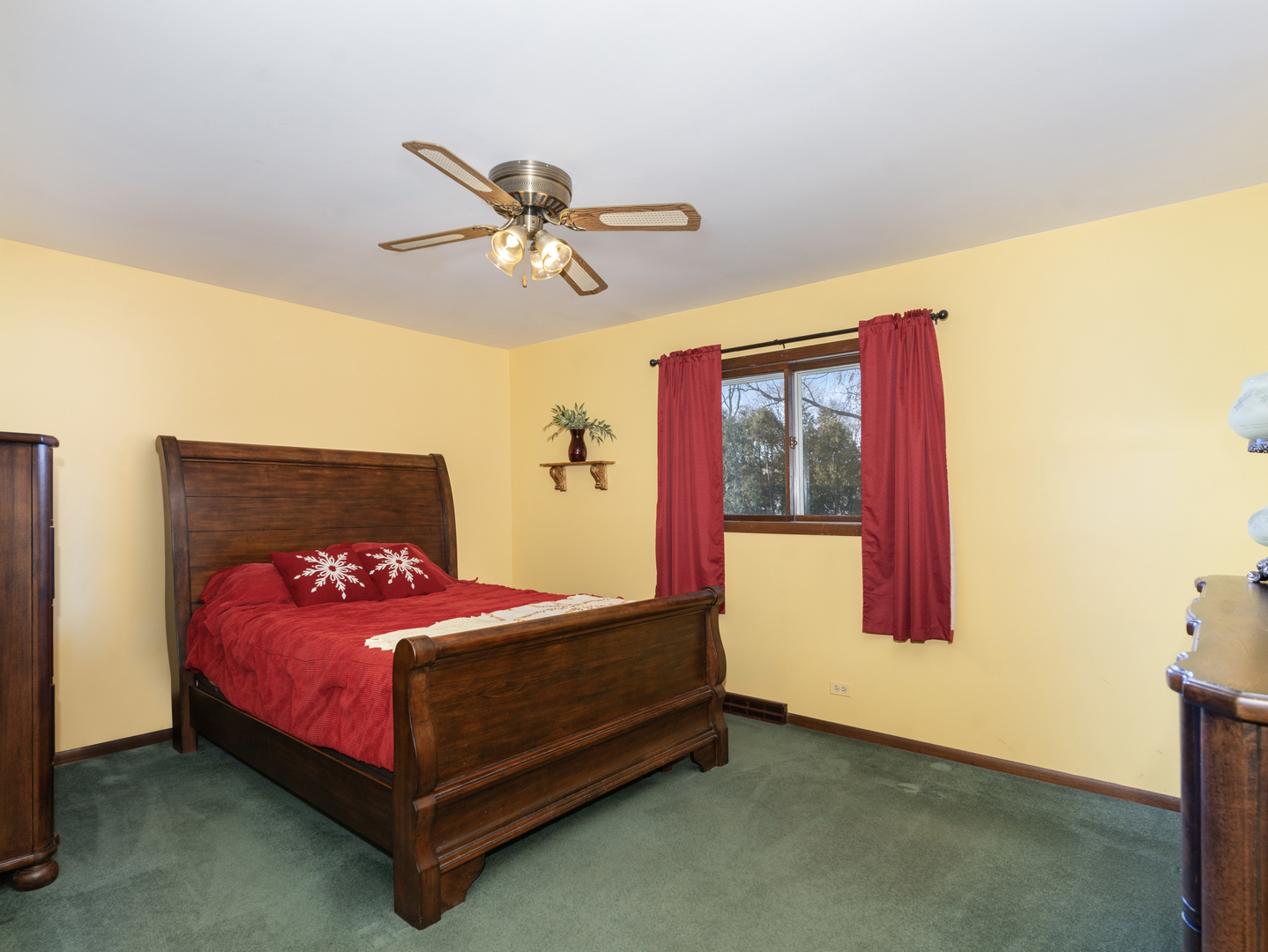 10S144 Ridge Road Naperville, IL 60565 - Photo 10 of 28 a bed sitting in a bedroom next to a window