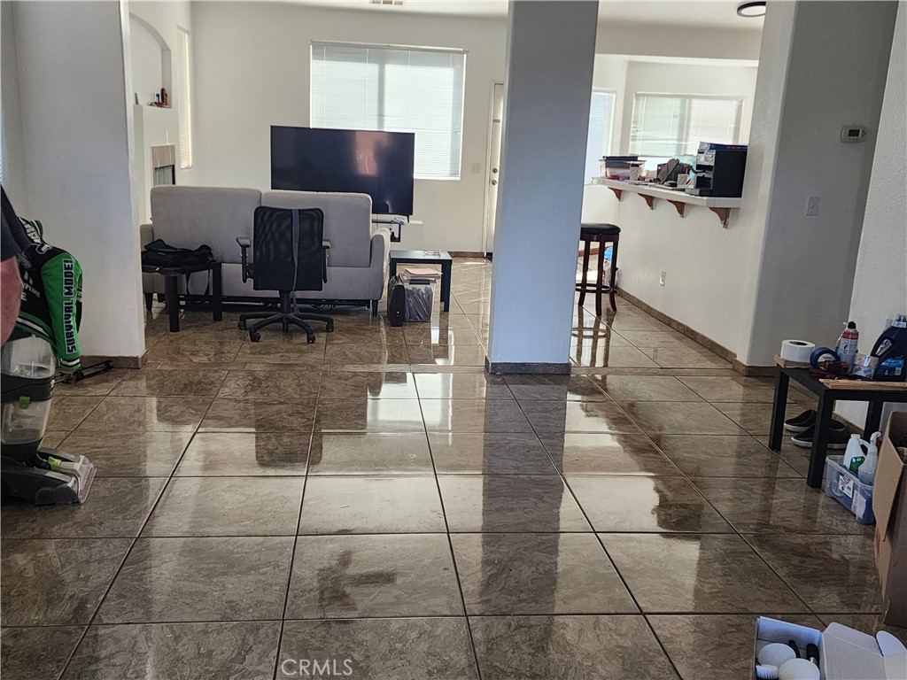 28455 Red Apple Road Menifee, CA 92585 - Photo 4 of 15 a living room with furniture a flat screen tv and a table