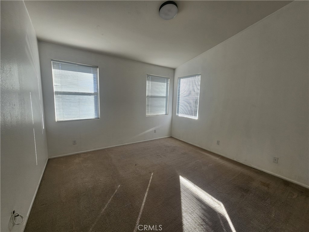 28455 Red Apple Road Menifee, CA 92585 - Photo 5 of 15 an empty room with windows