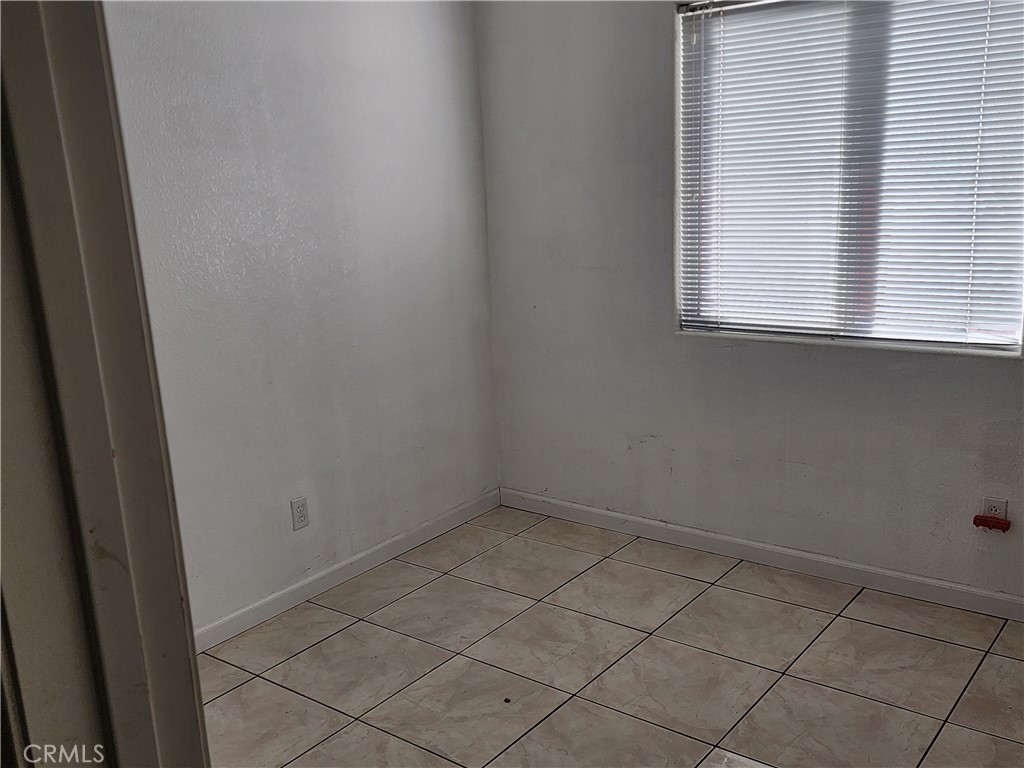 28455 Red Apple Road Menifee, CA 92585 - Photo 9 of 15 an empty room with a window