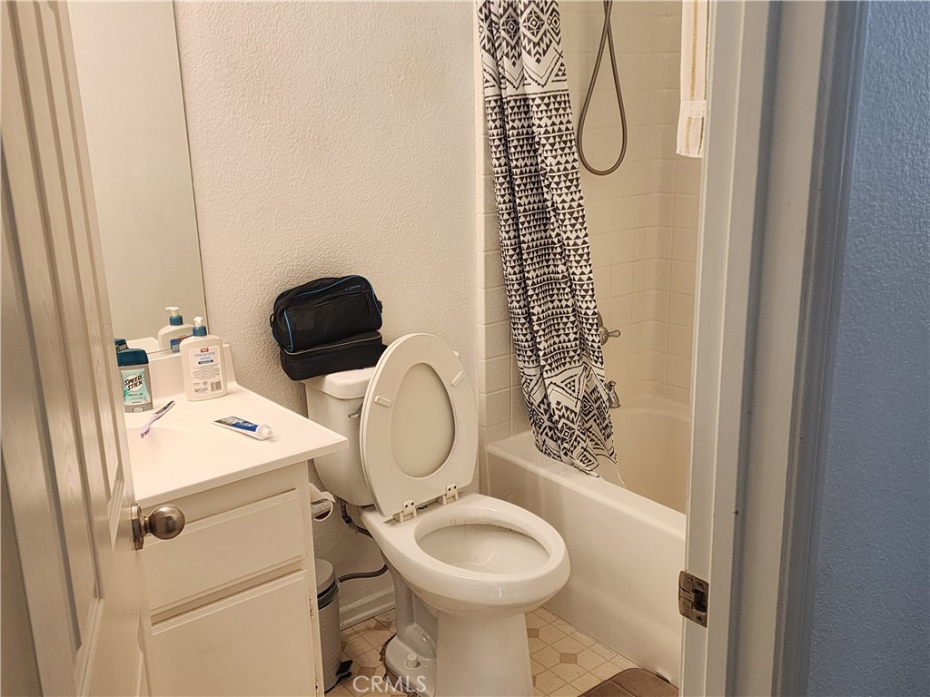 28455 Red Apple Road Menifee, CA 92585 - Photo 10 of 15 a bathroom with a sink toilet and shower