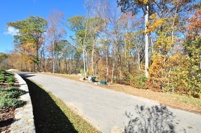 a view of swimming pool with a yard and seating area