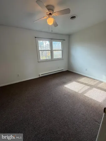 a view of empty room with a window