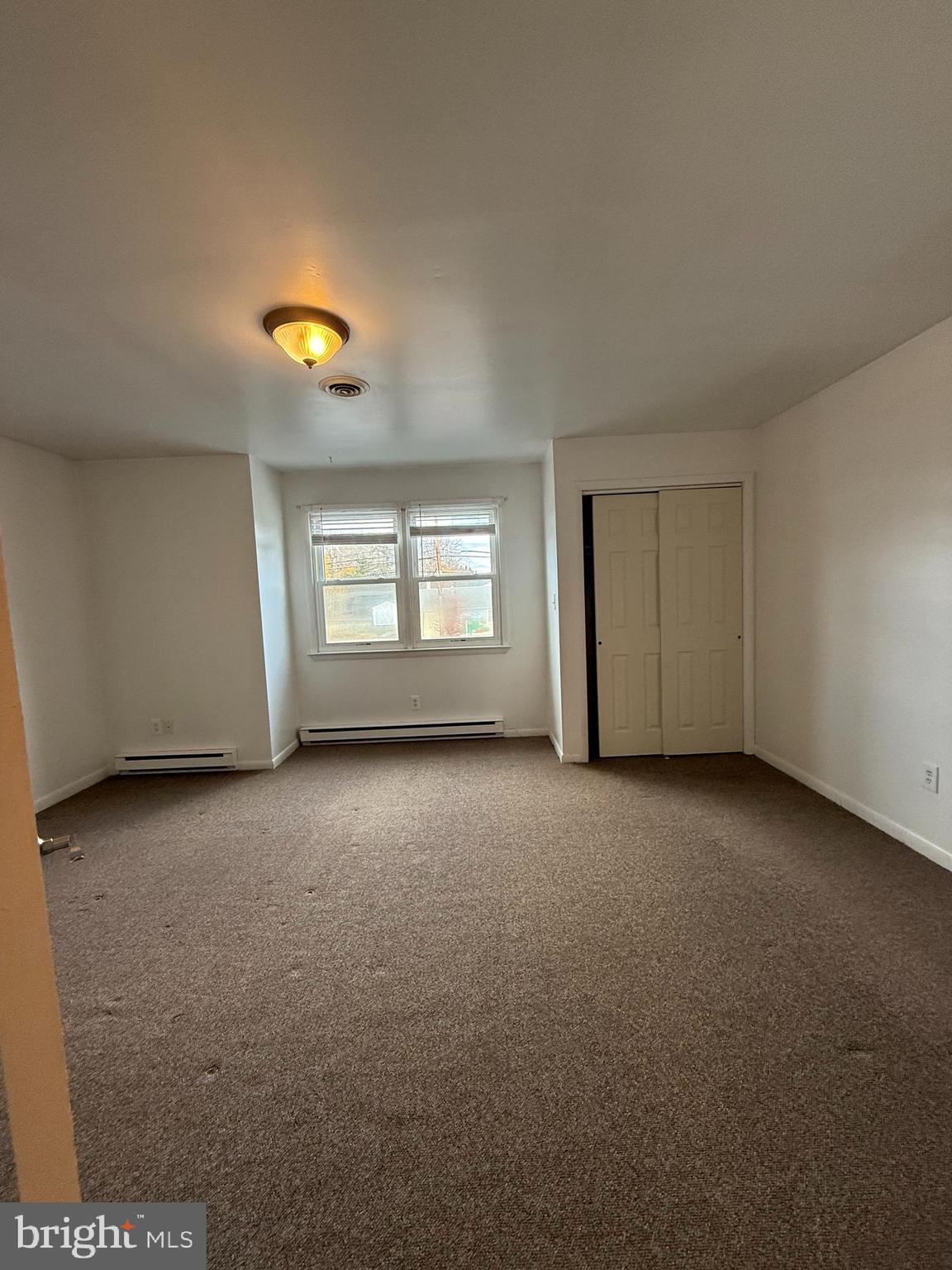 1123 Almond Road, Unit 2 Pittsgrove, NJ 08318 - Photo 5 of 9 a view of empty room with a window