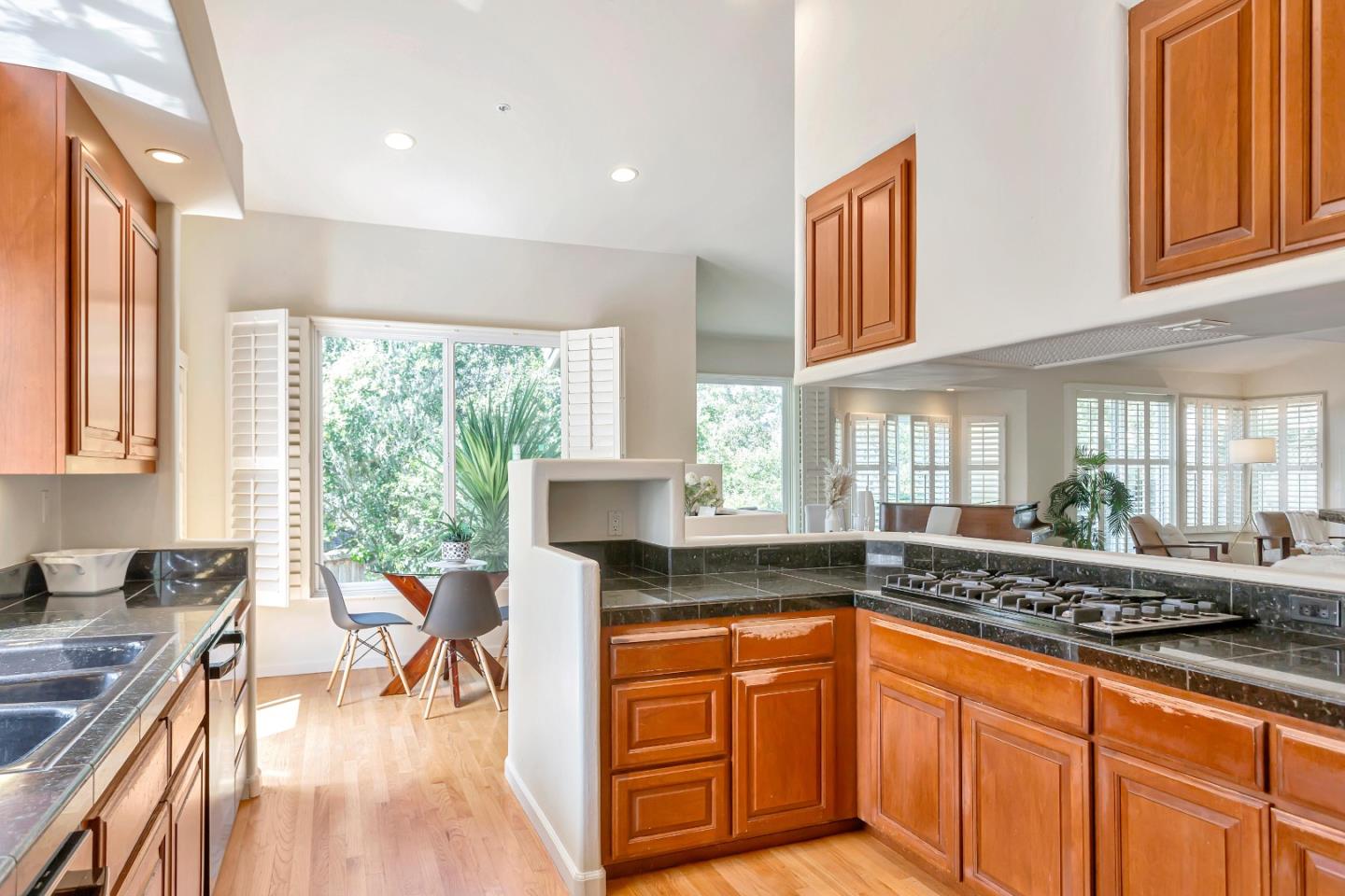 3120 Middle Ranch Road Pebble Beach, CA 93953 - Photo 12 of 39 a kitchen with stainless steel appliances granite countertop a stove a sink and a granite island