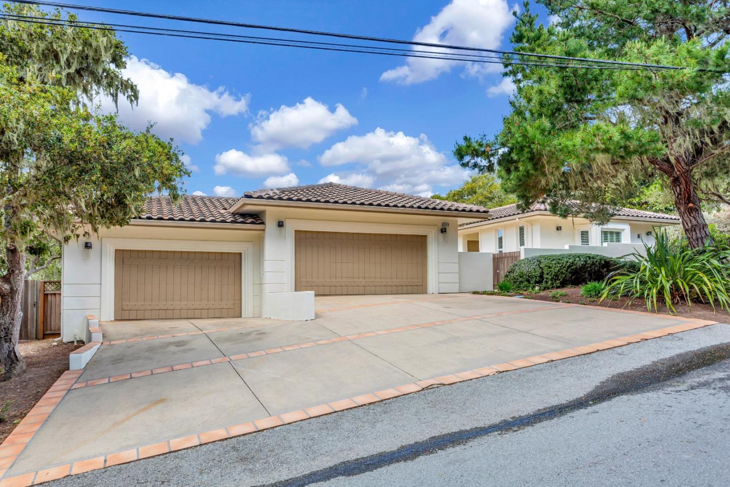 3120 Middle Ranch Road Pebble Beach, CA 93953 - Photo 2 of 39 a front view of a house with a garden
