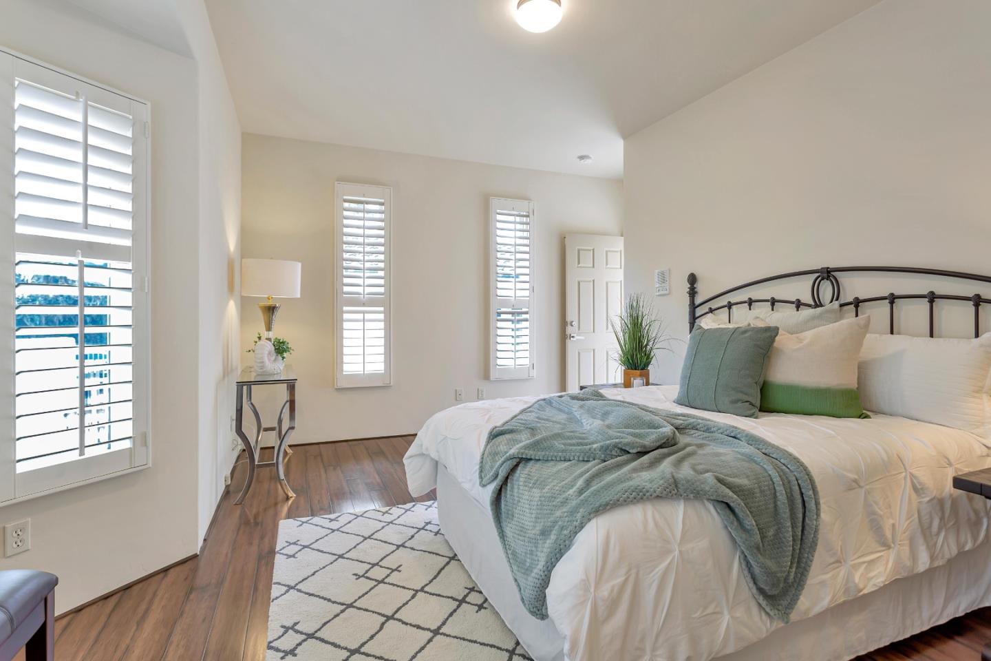 3120 Middle Ranch Road Pebble Beach, CA 93953 - Photo 25 of 39 a bedroom with a bed and wooden floor