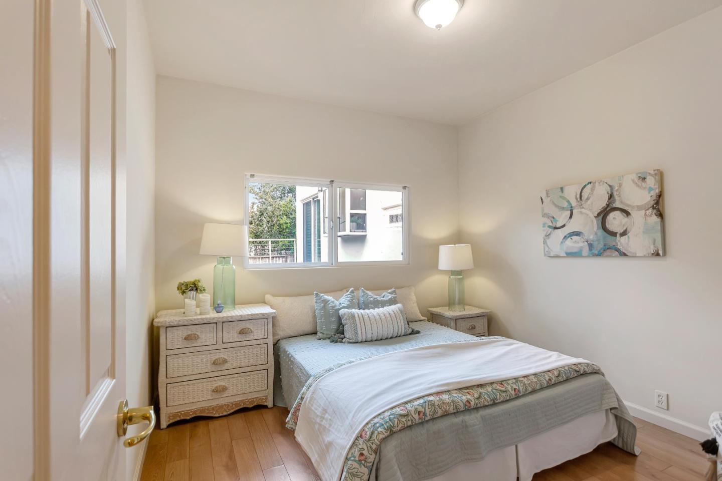 3120 Middle Ranch Road Pebble Beach, CA 93953 - Photo 32 of 39 a bedroom with a bed and wooden floor