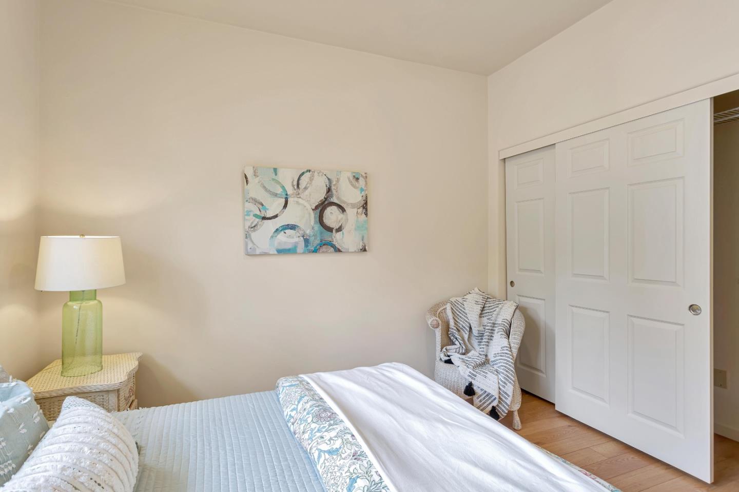 3120 Middle Ranch Road Pebble Beach, CA 93953 - Photo 33 of 39 a bedroom with a bed and a lamp