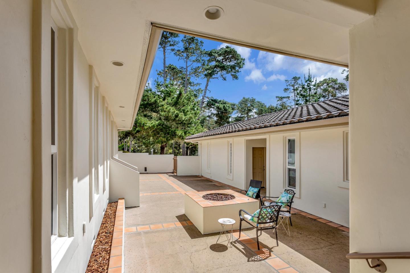 3120 Middle Ranch Road Pebble Beach, CA 93953 - Photo 4 of 39 a balcony with table and chairs
