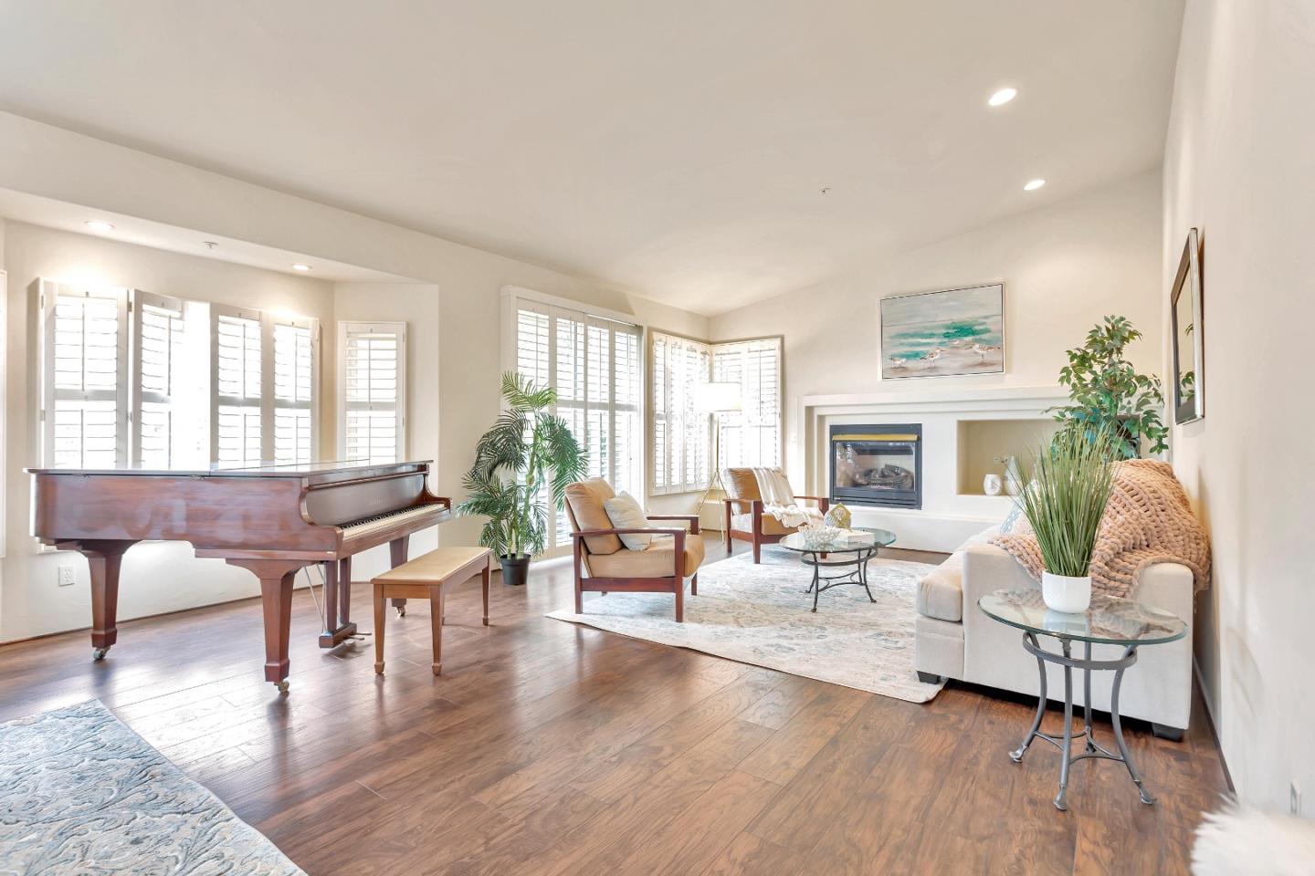 3120 Middle Ranch Road Pebble Beach, CA 93953 - Photo 8 of 39 a living room with fireplace furniture and a wooden floor