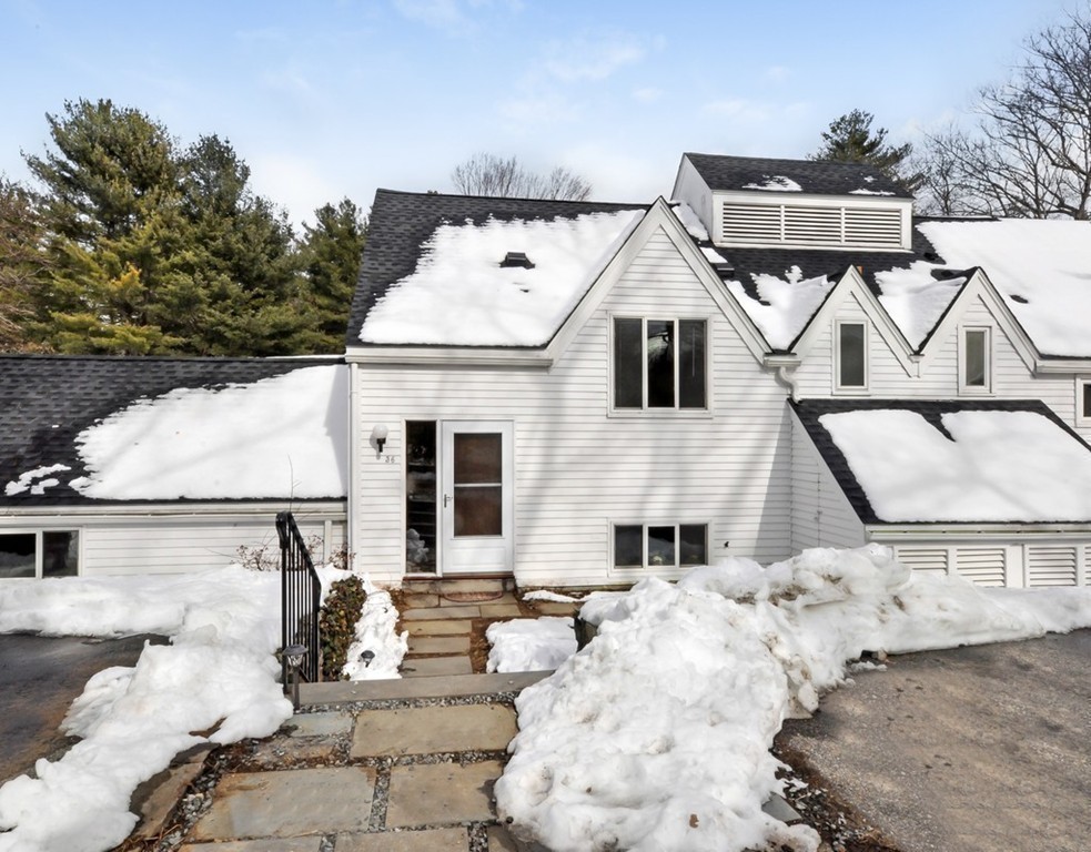 36 Todd Pond Road, Unit 36 Lincoln, MA 01773 - Photo 25 of 26 a front view of a house with a yard
