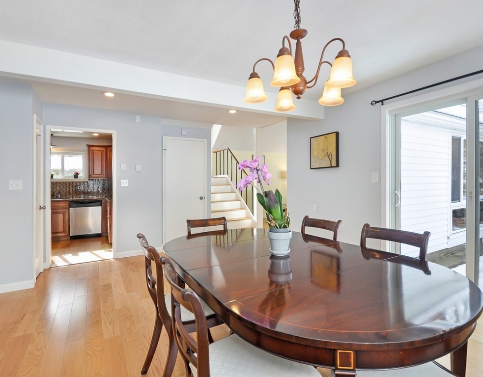 36 Todd Pond Road, Unit 36 Lincoln, MA 01773 - Photo 6 of 26 a dining room with furniture and chandelier