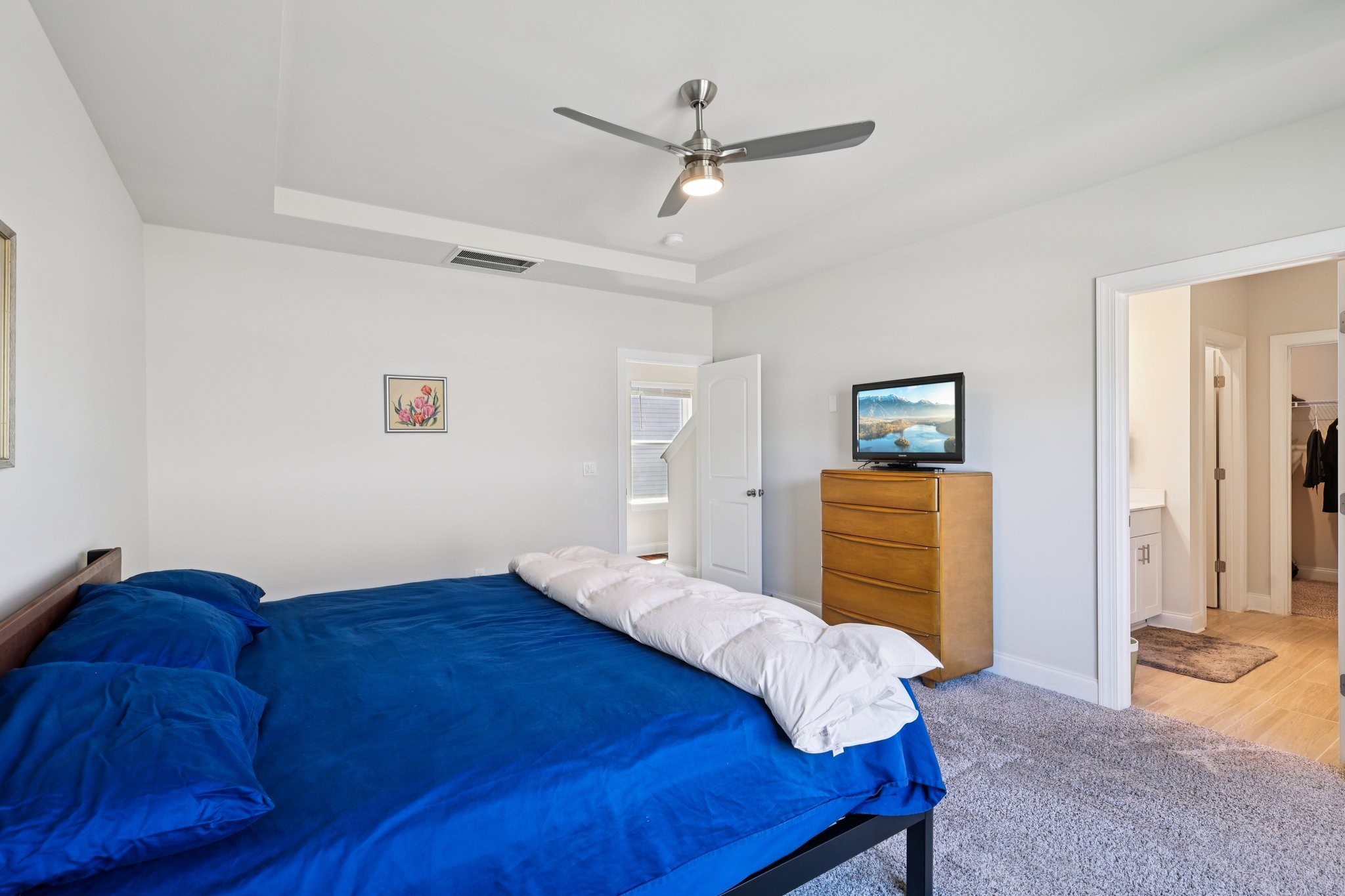 668 Taylor Bend Columbia, TN 38401 - Photo 18 of 35 a bed room with a bed and a chandelier