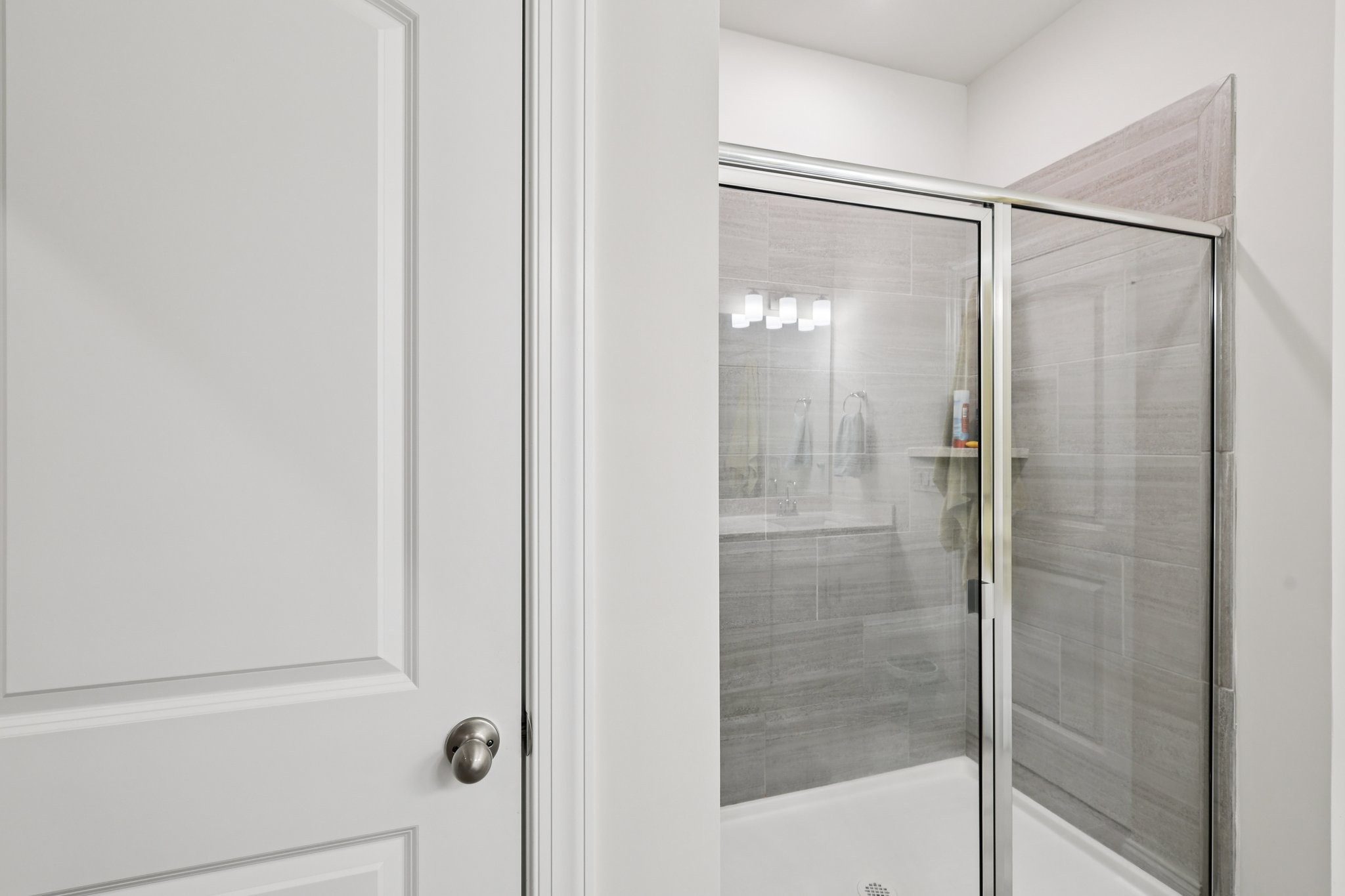 668 Taylor Bend Columbia, TN 38401 - Photo 20 of 35 a bathroom with a glass shower door