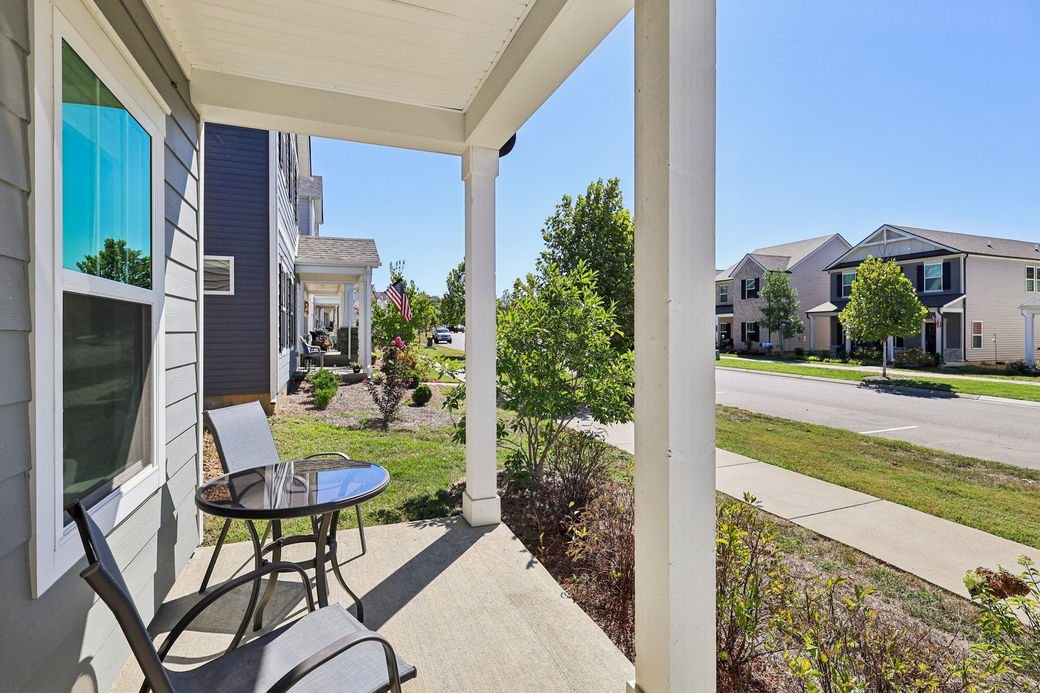668 Taylor Bend Columbia, TN 38401 - Photo 2 of 35 a view of a chair and tables in the patio in front of a house
