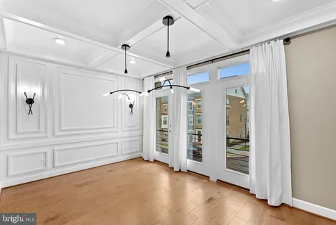 a large kitchen with a lot of cabinets and stainless steel appliances