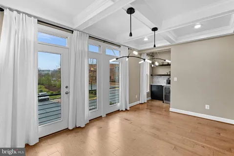 a large kitchen with a lot of counter space and a refrigerator