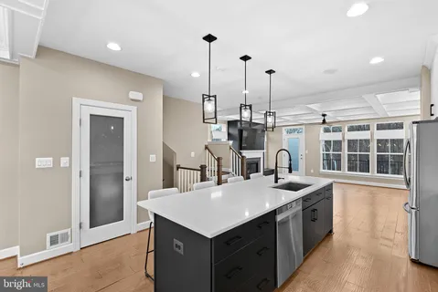 a kitchen with stainless steel appliances a stove and a refrigerator