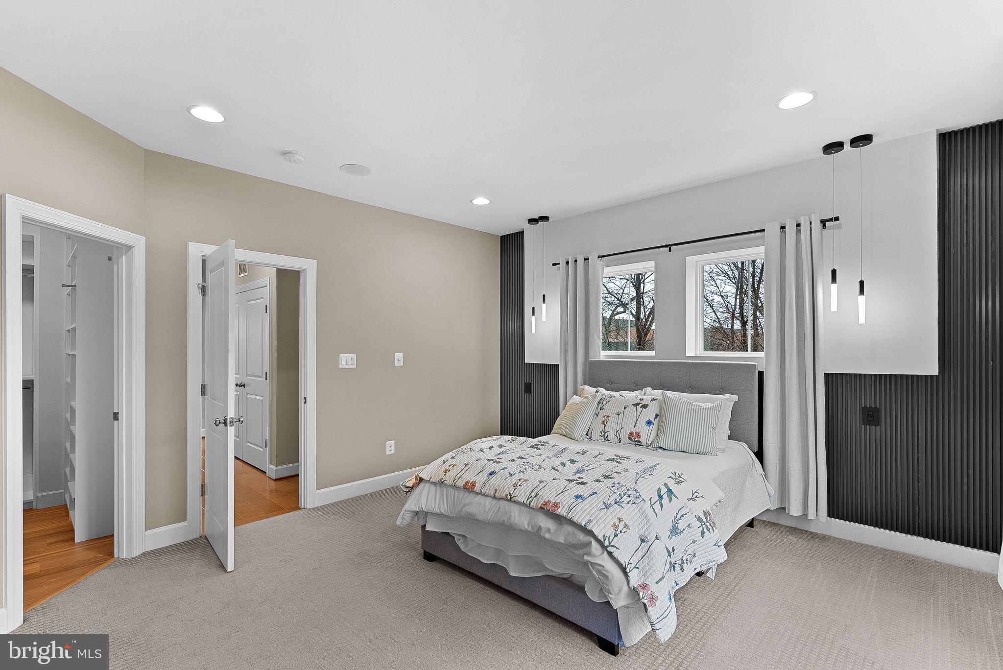 5159 Ridgeview Retreat Drive Chantilly, VA 20151 - Photo 27 of 59 a bedroom with a large bed and a chandelier