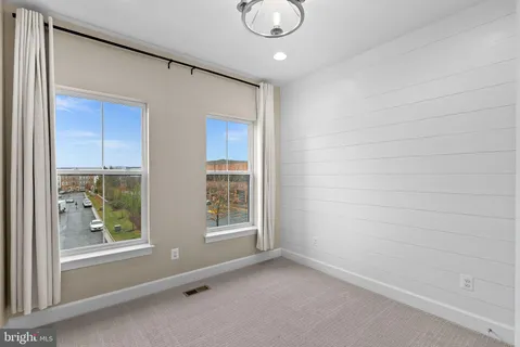 a view of utility room with racks on the wall