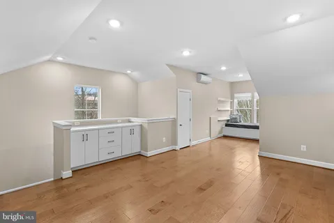 a view of livingroom with hardwood floor and stairs