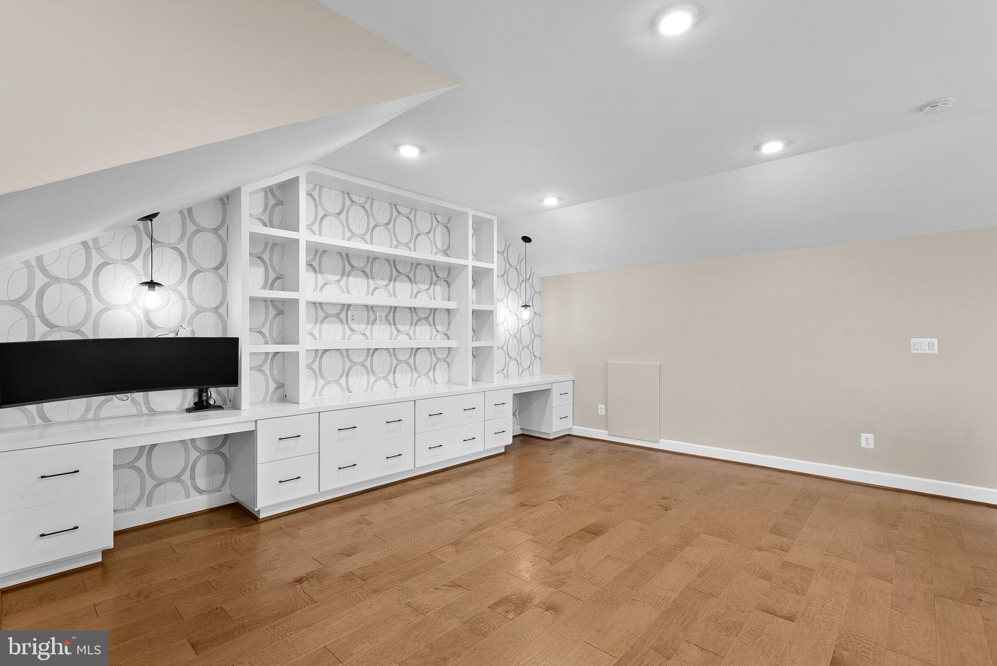 5159 Ridgeview Retreat Drive Chantilly, VA 20151 - Photo 39 of 59 a view of an empty room with a cabinet and flat screen tv