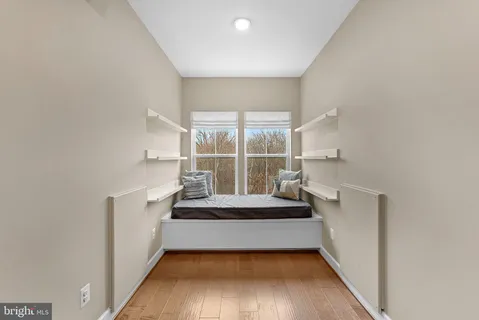 a view of a balcony with wooden fence