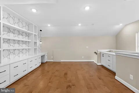 a view of a balcony with wooden floor