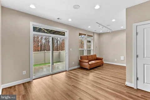 a view of a backyard with large trees