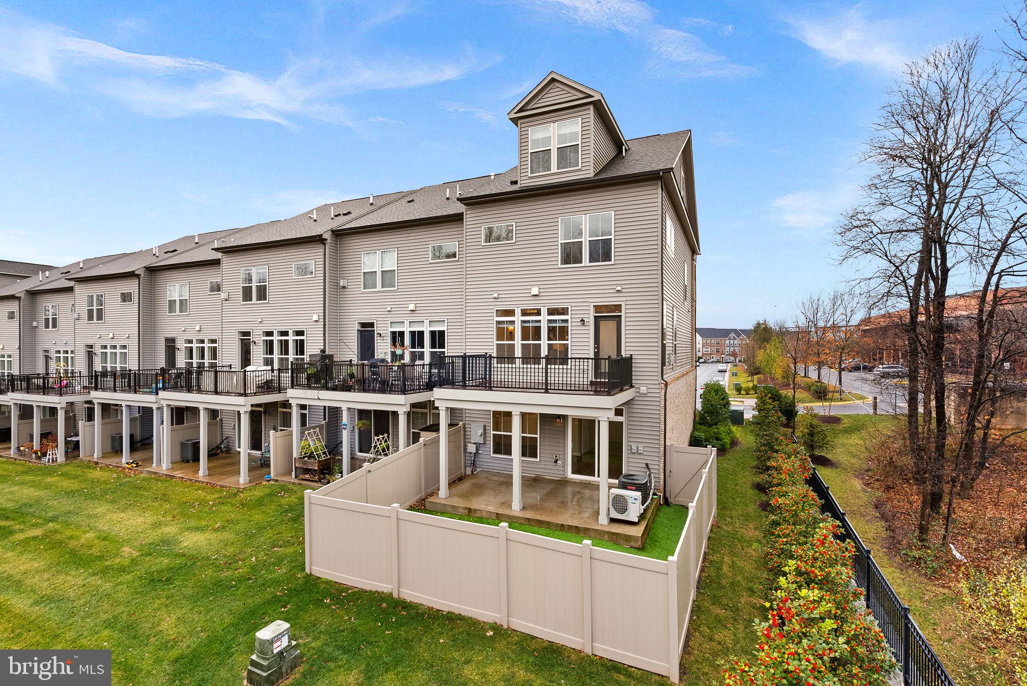 5159 Ridgeview Retreat Drive Chantilly, VA 20151 - Photo 50 of 59 a front view of a house with a yard table and chairs