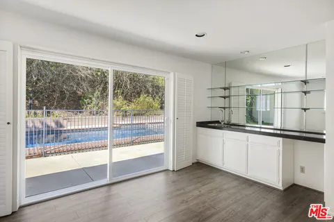 a kitchen with stainless steel appliances granite countertop a stove and a sink