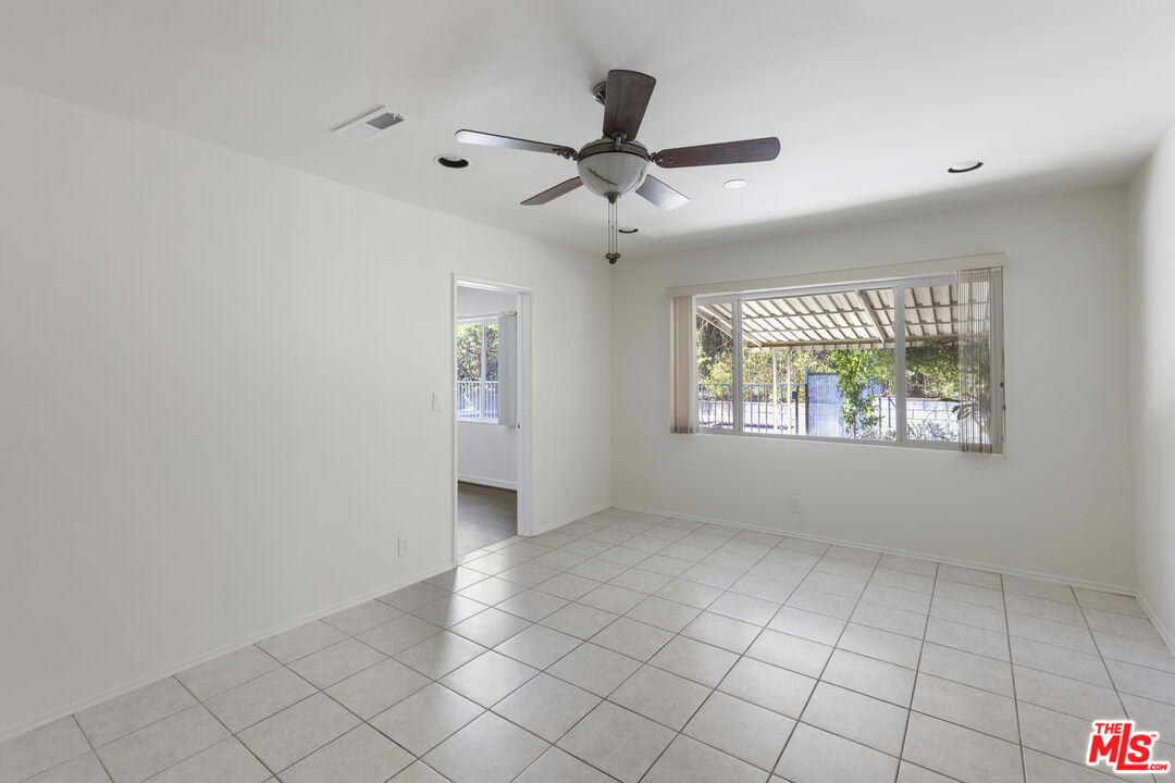 15508 Royal Ridge Road Sherman Oaks, CA 91403 - Photo 9 of 39 a view of an empty room with a window