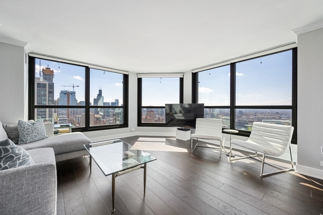Undisclosed Address Chicago, IL 60610 - Photo 2 of 8 a living room with furniture and a large window